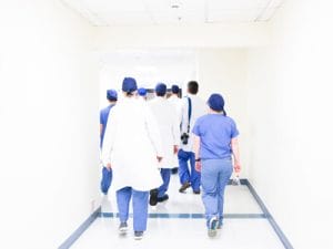 Nurses and doctors walking down a hallway in a hospital | Houghton County Medical Care